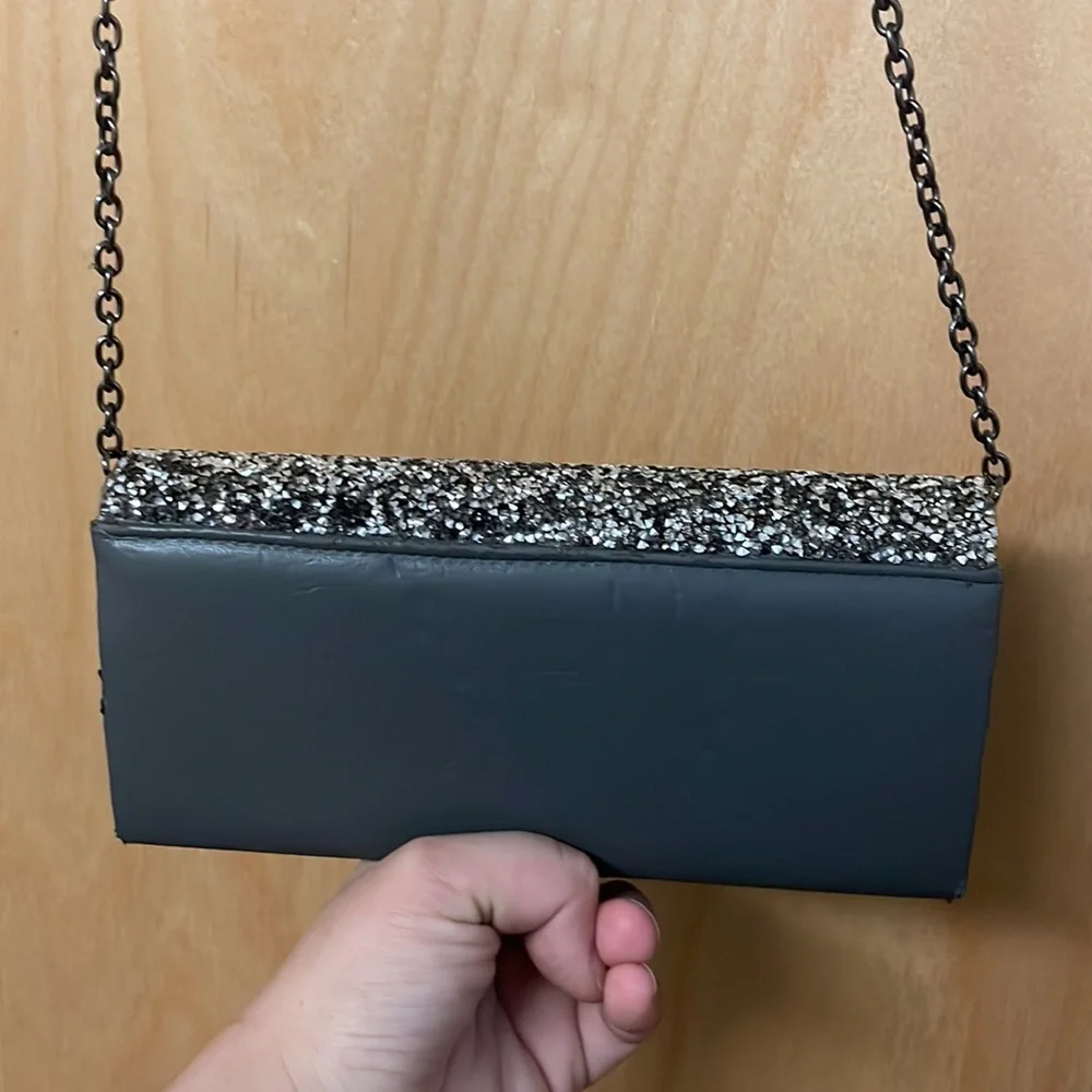 Saks Fifth Avenue sparkly gemstones clutch with chain link strap.